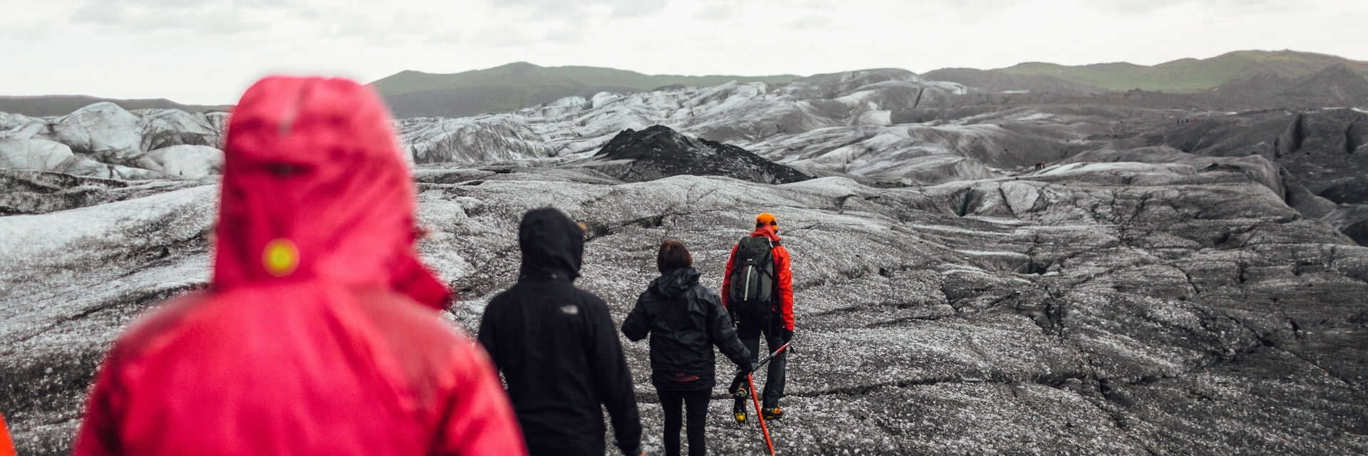 A group hiking in a line on Svínafellsjökull Glacier in the Skaftafell National Park Iceland. This glacier has been used as a filming location for many feature films.
